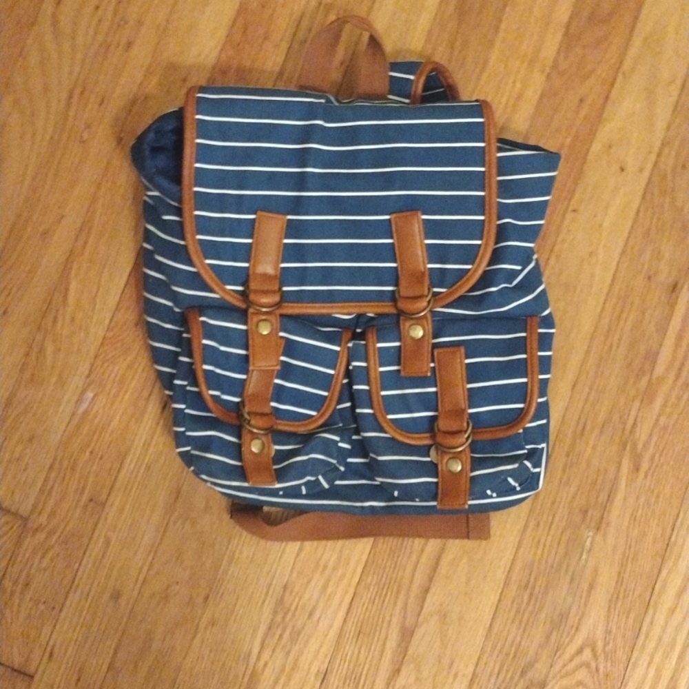 Blue and white striped backpack holds alot for kids